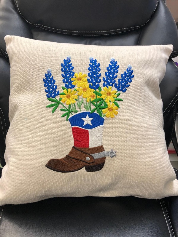 Pillow with embroidered flower