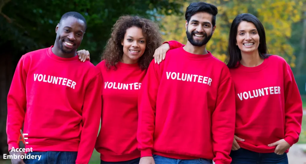 Community volunteer shirts displayed in various colors, promoting local engagement and teamwork through branded apparel